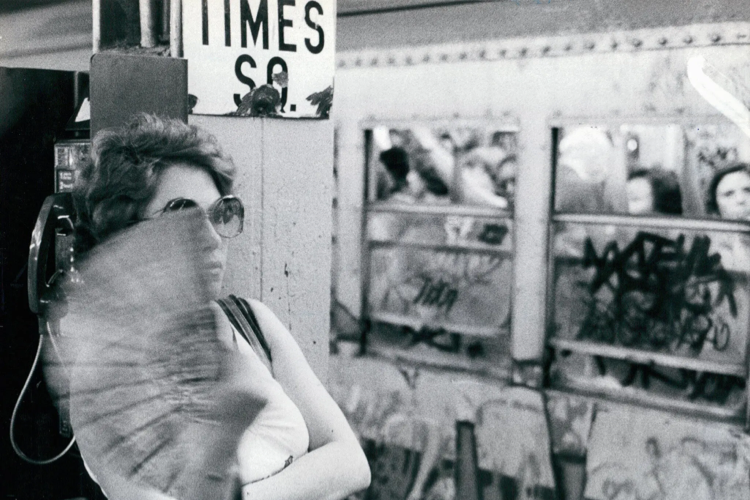 Woman Sweating on New York City Subway During Summer